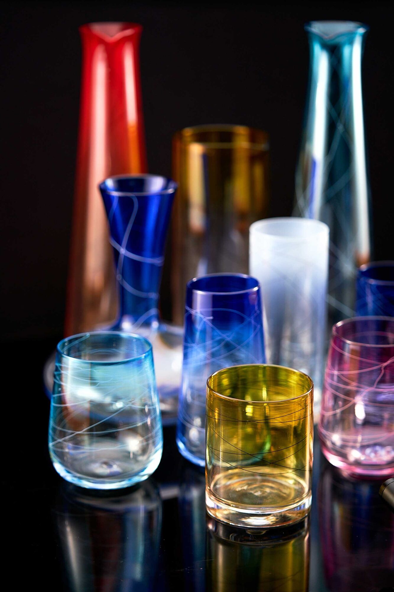  This eye-catching collection of colored glassware by Joseph Webster is made for everyday use. 