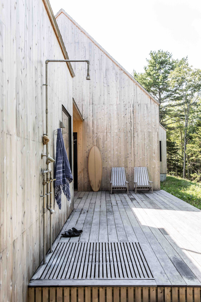 An outdoor shower on the deck gives the active family an additional spot to wash up, weather permit- ting, after hikes or the beach.